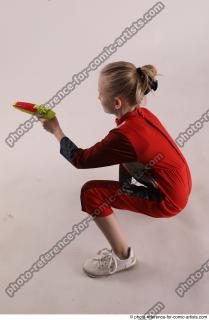 DENISA SITTING POSE WITH GUN